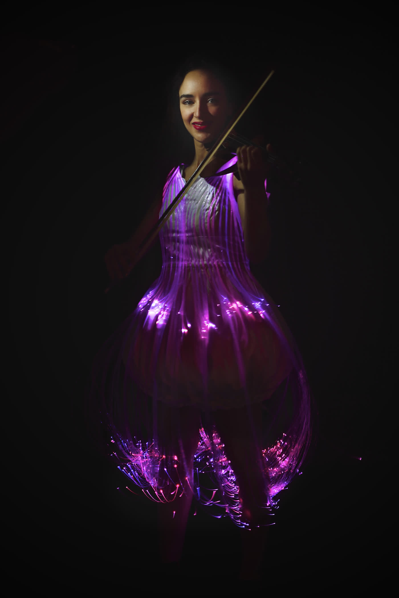 The couture light dress glowing magenta